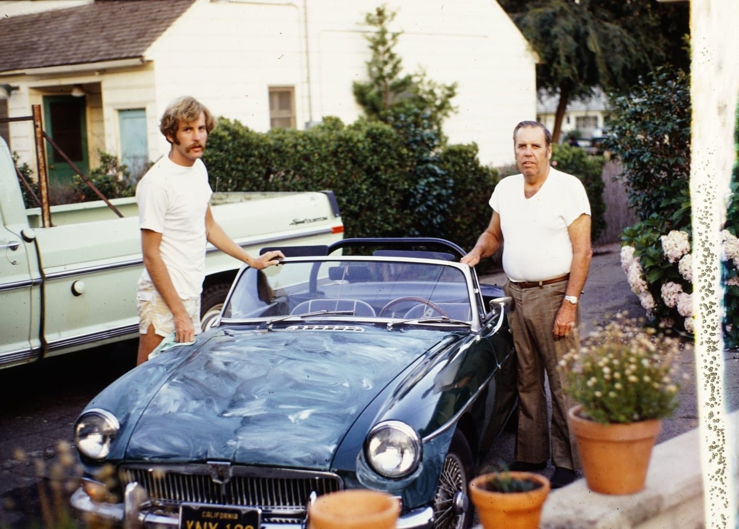 Ron with an MGB in a family photograph from 1972
