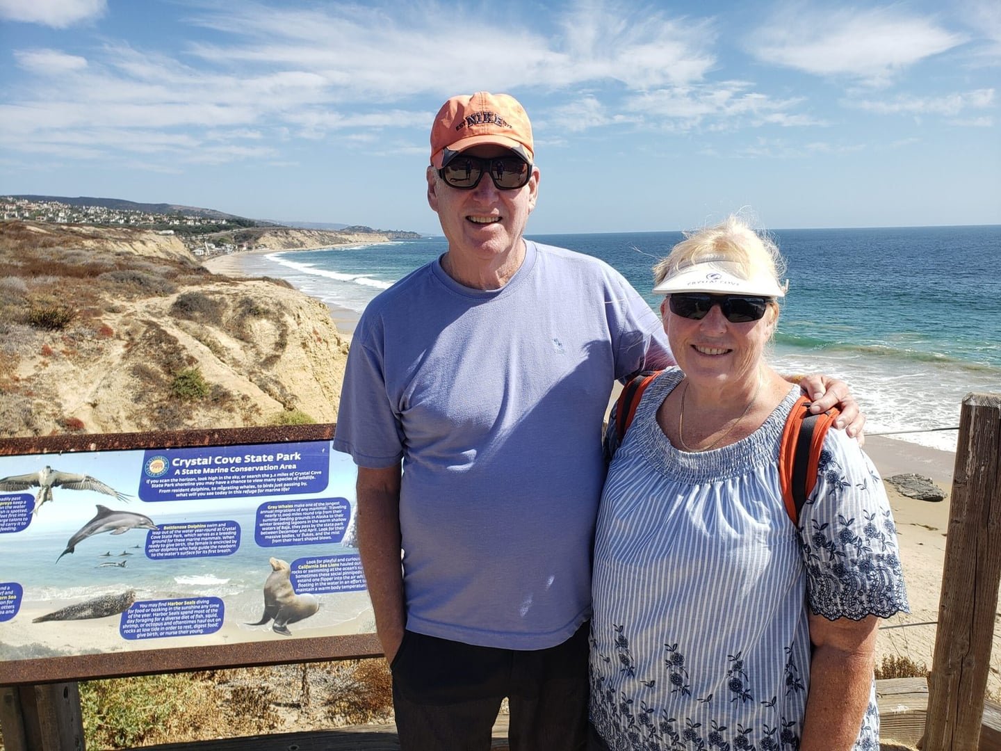 Ron and Mary Ellen smiling beside the ocean in 2019